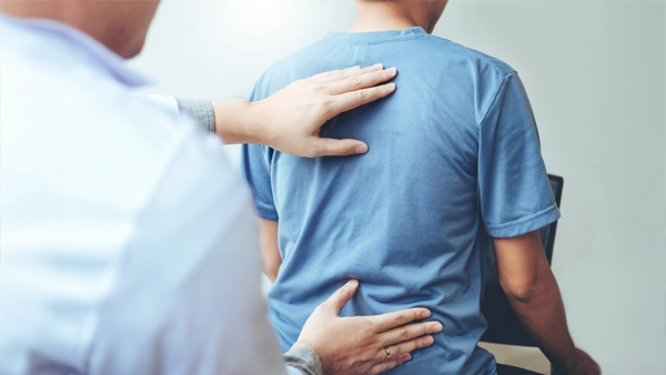 Chiropractic Kalamazoo MI Back Exam Chiropractor giving a back exam.