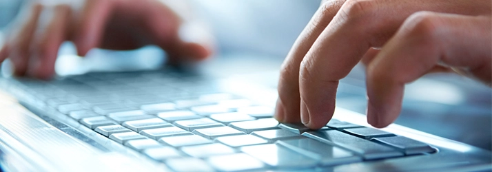 Chiropractic Stratford CT Hands On A Keyboard Person typing on a keyboard.